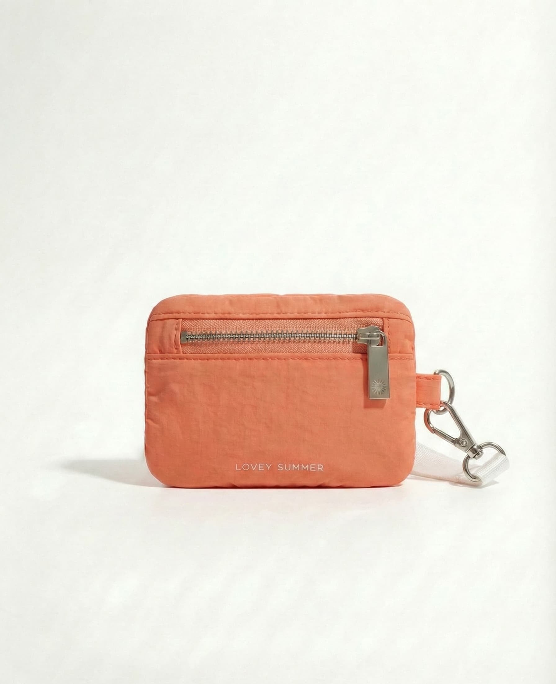 Orange wallet with a keychain on a white background