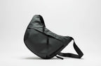 Black waist bag on a light gray background,A stylish, waterproof black nylon crossbody bag for men and women, perfect for travel, college, and daily use. Featuring a sleek design with multiple compartments, this unisex sling bag offers premium quality and durability. Ideal for the urban lifestyle, it's a versatile shoulder bag that blends fashion and function, making it a must-have accessory for trendsetters in India. #CrossbodyBag #NylonBag #SlingBag #UnisexFashion #TravelEssentials #CollegeBag #DailyUseBa