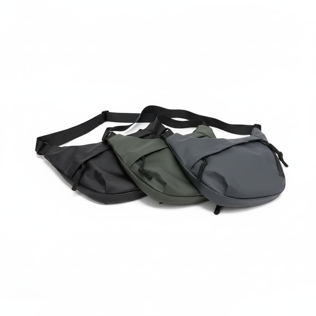Three waist bags in black, green, and gray on a white backgroundA stylish, waterproof black nylon crossbody bag for men and women, perfect for travel, college, and daily use. Featuring a sleek design with multiple compartments, this unisex sling bag offers premium quality and durability. Ideal for the urban lifestyle, it's a versatile shoulder bag that blends fashion and function, making it a must-have accessory for trendsetters in India. #CrossbodyBag #NylonBag #SlingBag #UnisexFashion #TravelEssentials #C