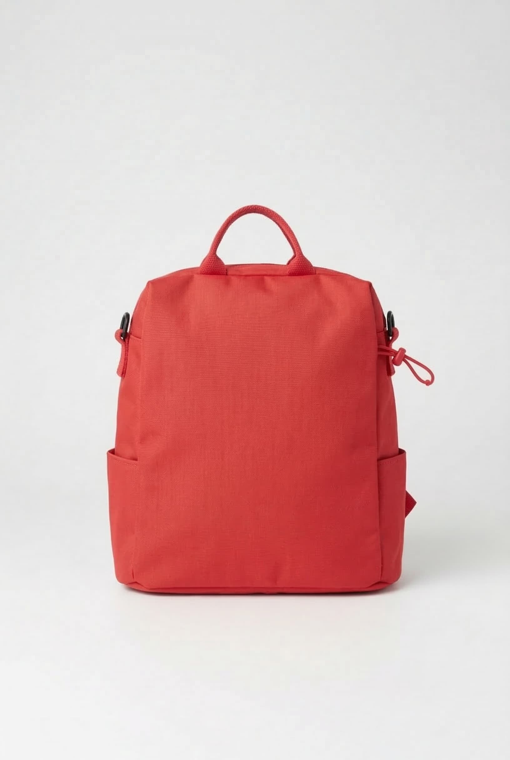 Red backpack on a white background