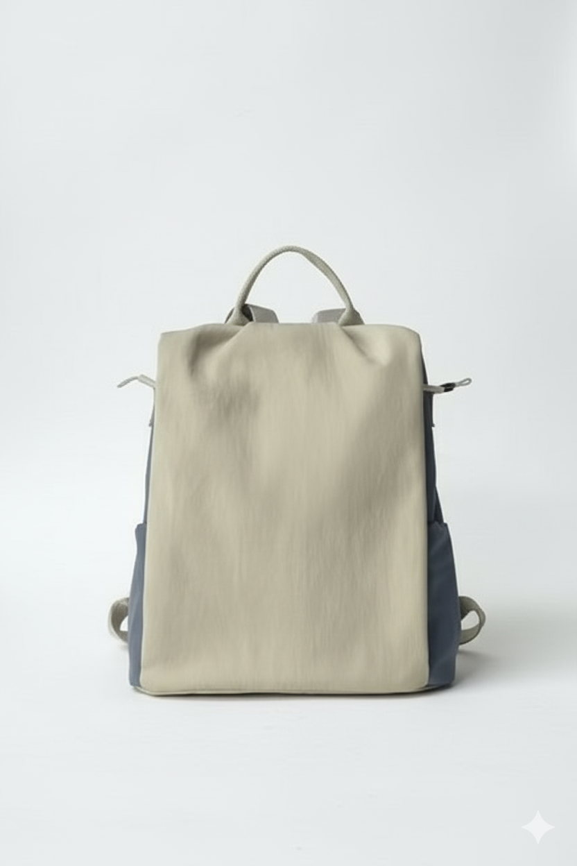 Beige and navy backpack on a white backgroundStylish travel backpack, durable everyday bag, versatile shoulder tote, convertible backpack purse, waterproof utility bag, modern casual rucksack, ergonomic daypack, trendy laptop bag, multi-functional women's backpack, secure anti-theft design, spacious college bag, fashion-forward accessory, urban commuter pack, comfortable carry-all, premium quality satchel, practical work bag, chic student backpack, easy-access travel essential, organized personal item, ligh