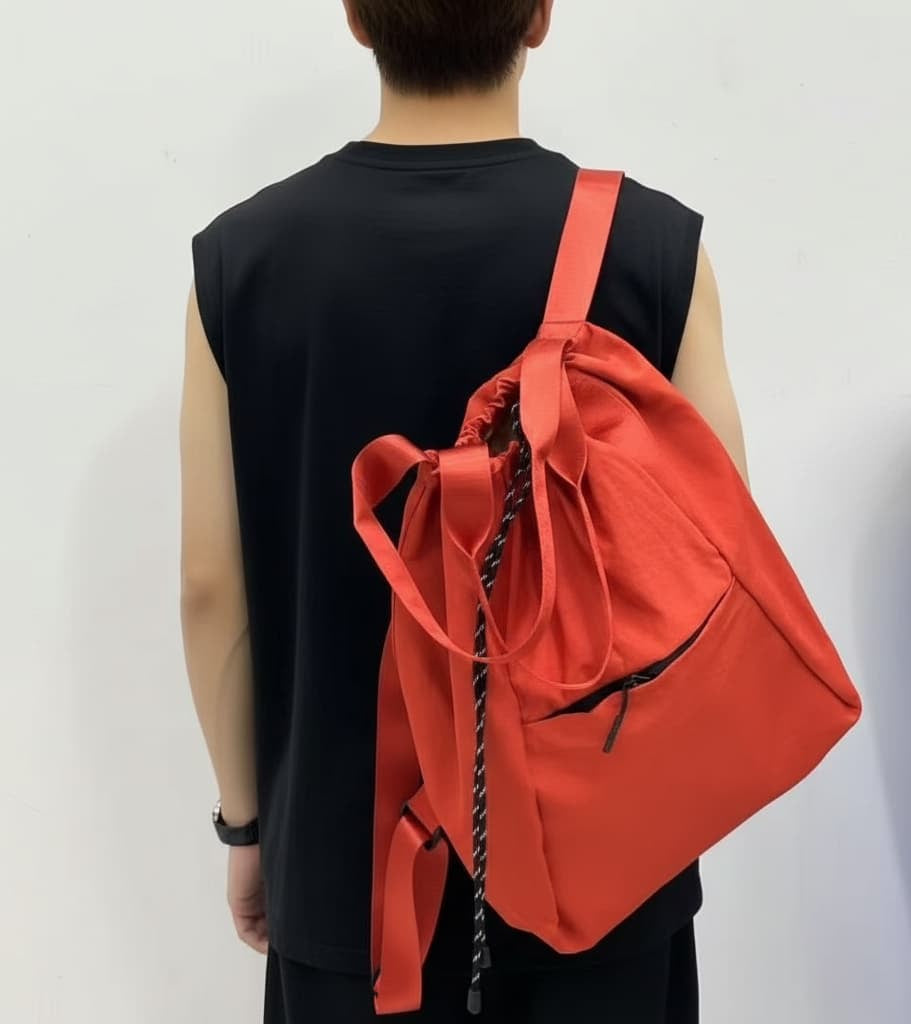 Person wearing a red drawstring bag on a plain background,Black backpack with drawstring on a white background,"Stylish khaki drawstring tote bag with multiple compartments and adjustable straps, perfect for daily use, shopping, and travel in India. Features include a secure zippered pocket, spacious main compartment, and comfortable shoulder straps. Ideal for fashion-conscious individuals seeking a versatile and trendy bag."