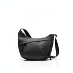 Black shoulder bag on a white backgroundA stylish, waterproof black nylon crossbody bag for men and women, perfect for travel, college, and daily use. Featuring a sleek design with multiple compartments, this unisex sling bag offers premium quality and durability. Ideal for the urban lifestyle, it's a versatile shoulder bag that blends fashion and function, making it a must-have accessory for trendsetters in India. #CrossbodyBag #NylonBag #SlingBag #UnisexFashion #TravelEssentials #CollegeBag #DailyUseBag #