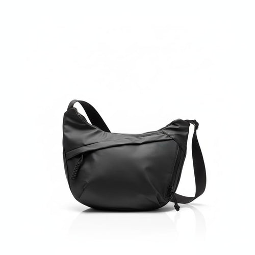 Black shoulder bag on a white backgroundA stylish, waterproof black nylon crossbody bag for men and women, perfect for travel, college, and daily use. Featuring a sleek design with multiple compartments, this unisex sling bag offers premium quality and durability. Ideal for the urban lifestyle, it's a versatile shoulder bag that blends fashion and function, making it a must-have accessory for trendsetters in India. #CrossbodyBag #NylonBag #SlingBag #UnisexFashion #TravelEssentials #CollegeBag #DailyUseBag #