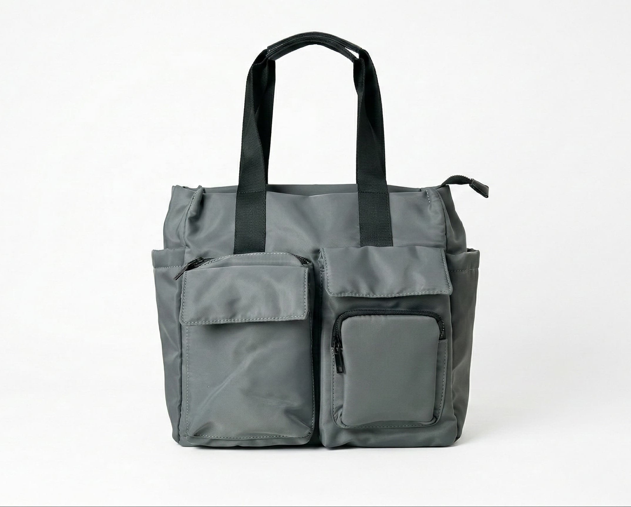 Gray tote bag with black handles on a white background