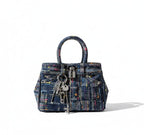 Multicolored handbag with keys on a white background