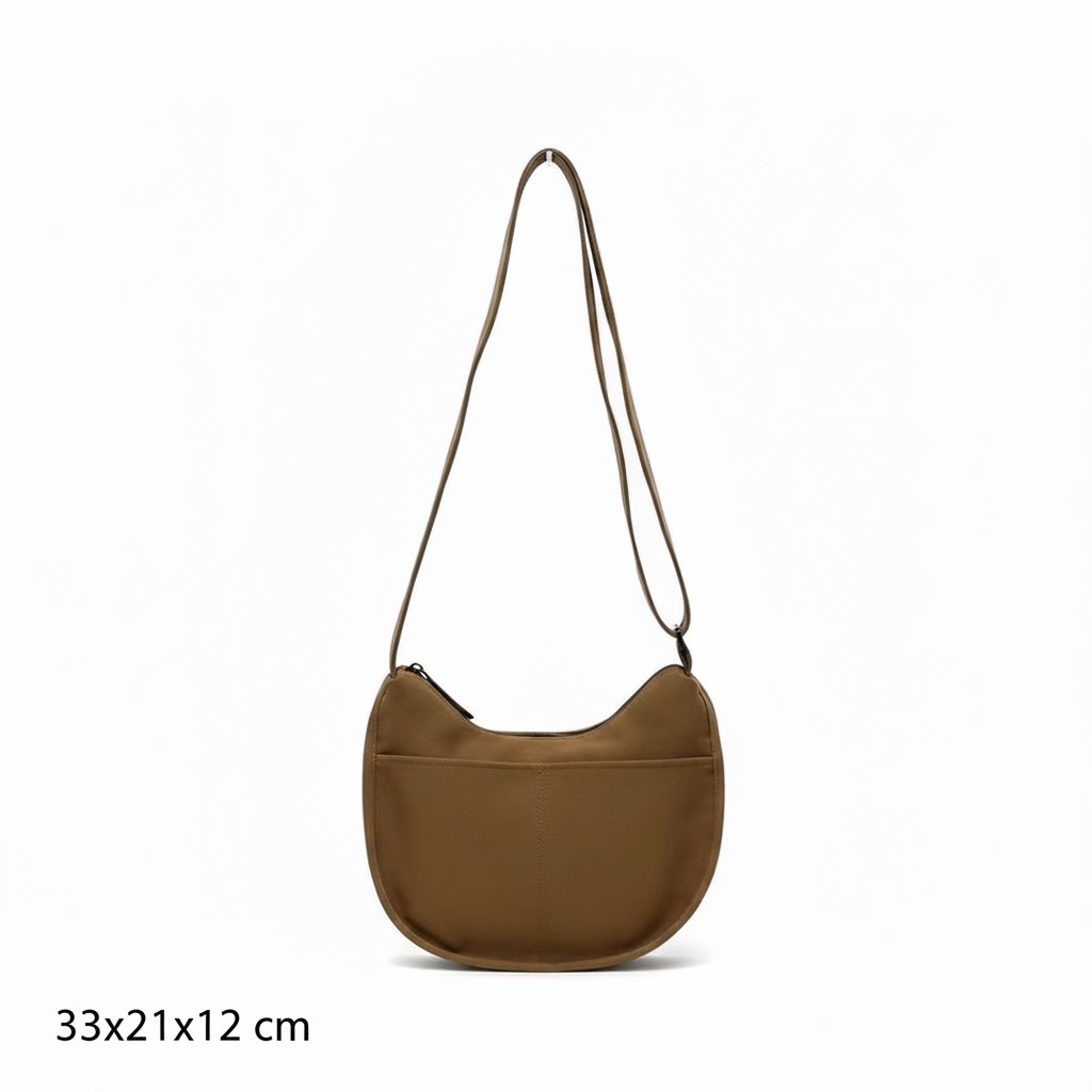 Trendy emerald green crescent half-moon shoulder bag for women, durable canvas, versatile for daily use, ethnic wear, and casual outings in India. This stylish sling bag offers a modern minimalist design, spacious interior, functioning as a chic carryall or small hobo tote.