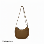 Trendy emerald green crescent half-moon shoulder bag for women, durable canvas, versatile for daily use, ethnic wear, and casual outings in India. This stylish sling bag offers a modern minimalist design, spacious interior, functioning as a chic carryall or small hobo tote.