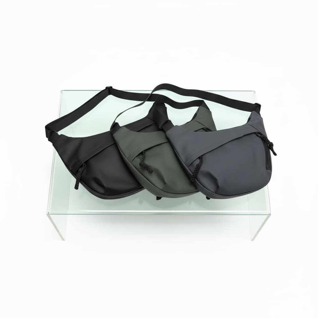 Three bags in black, gray, and dark gray on a clear stand with a white background