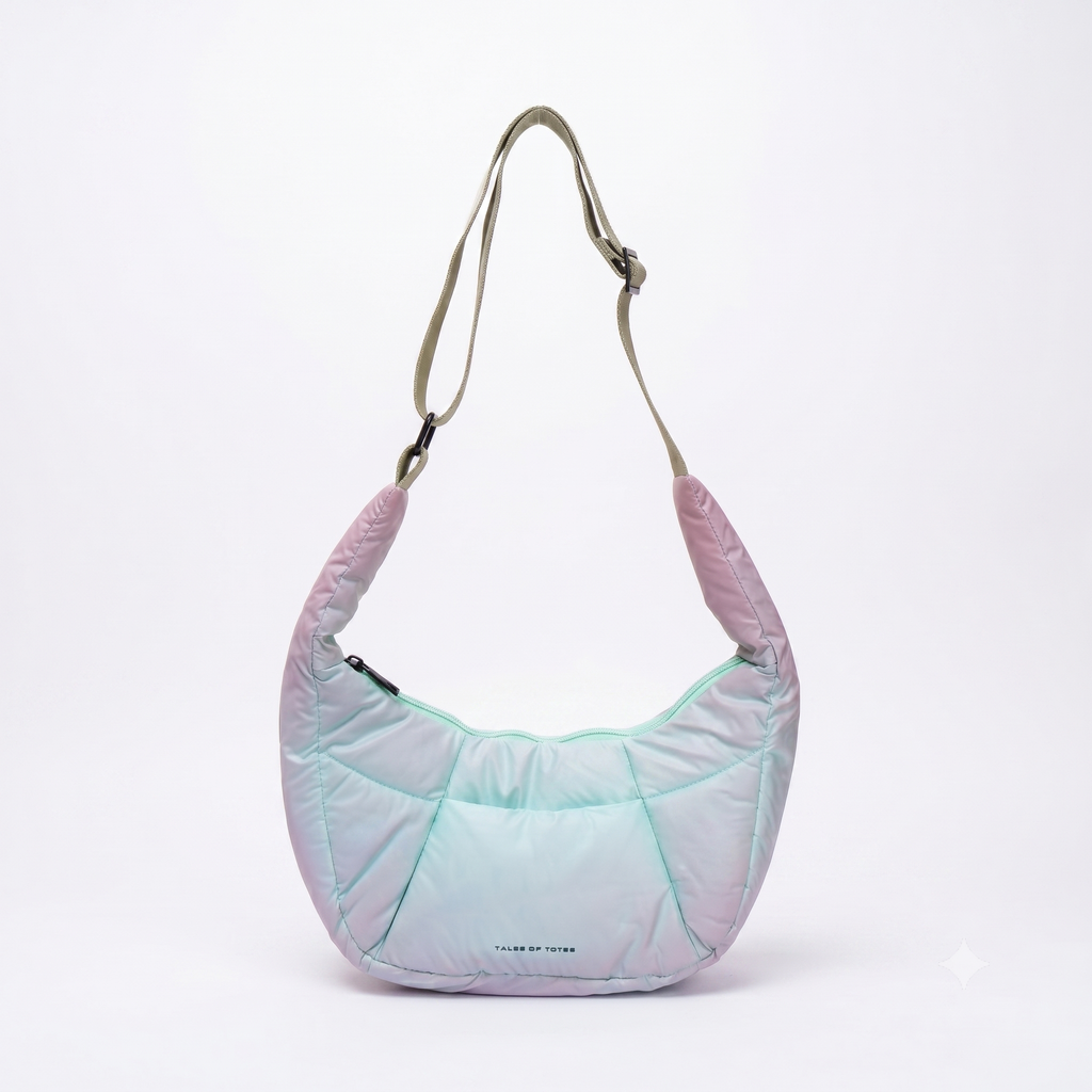 Light purple quilted handbag with a strap on a white background