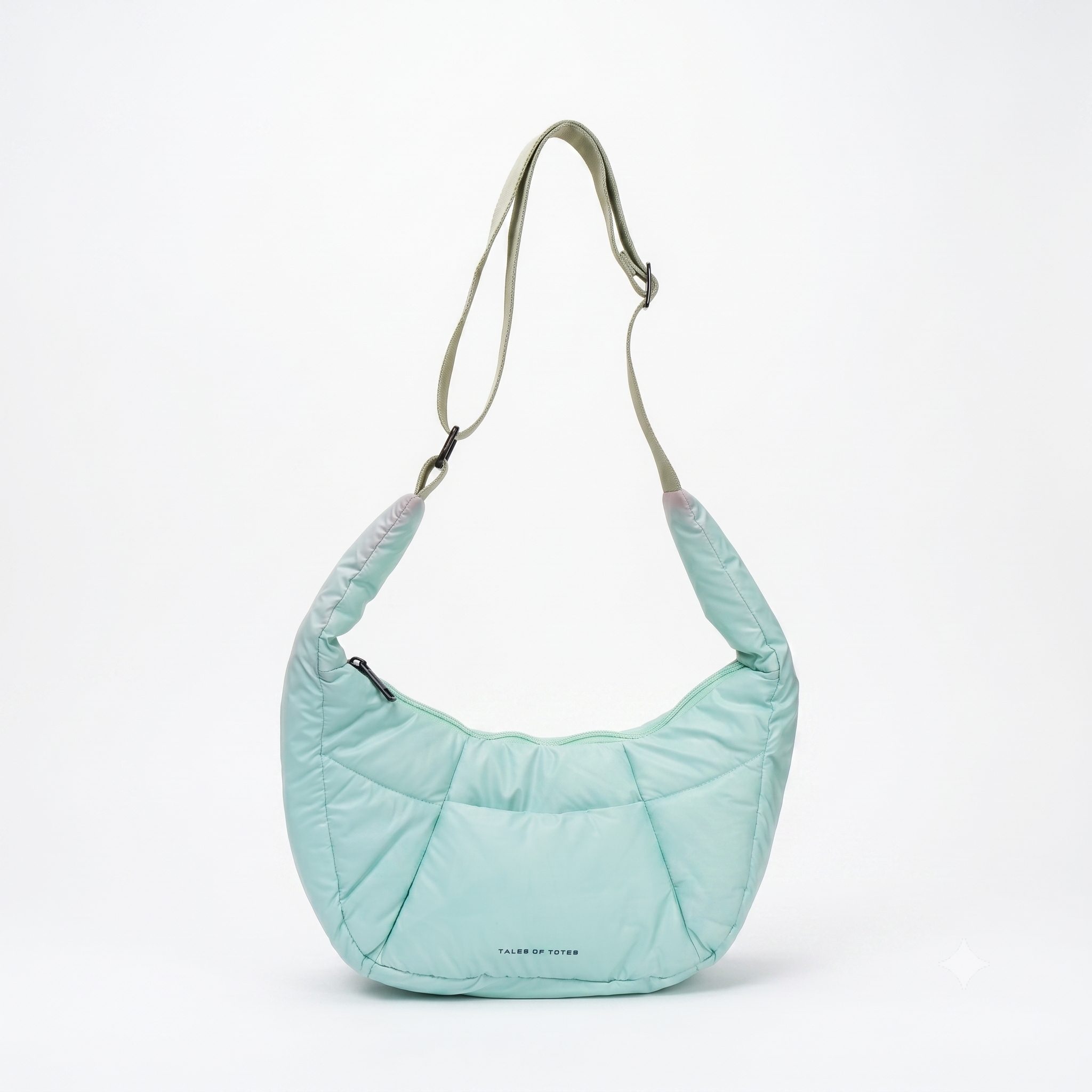Light blue quilted handbag with a strap on a white background