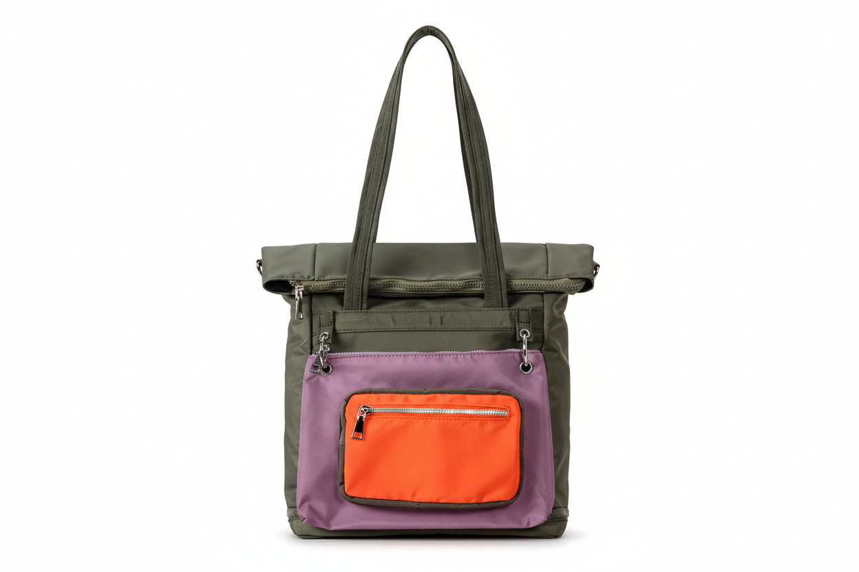 Multicolored tote bag with orange pocket on a gray background