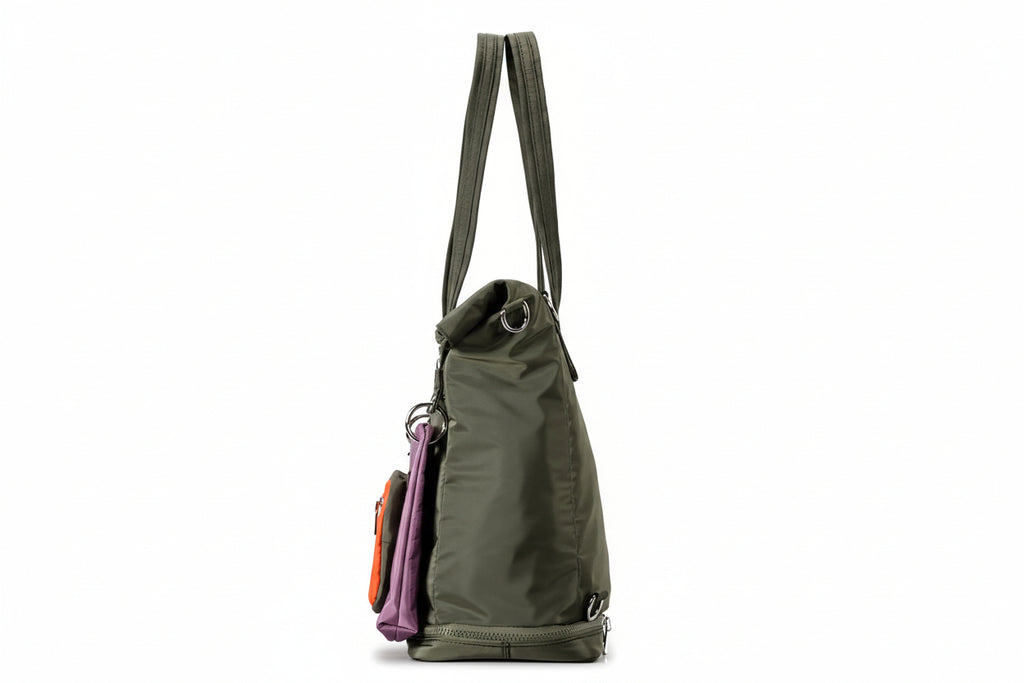 Green backpack with multiple compartments on a gray background