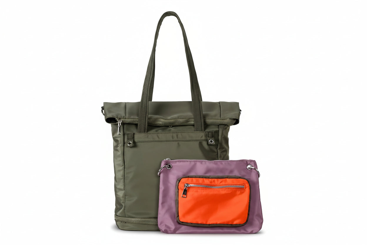 Green tote bag with a purple pouch featuring an orange pocket on a light gray background.