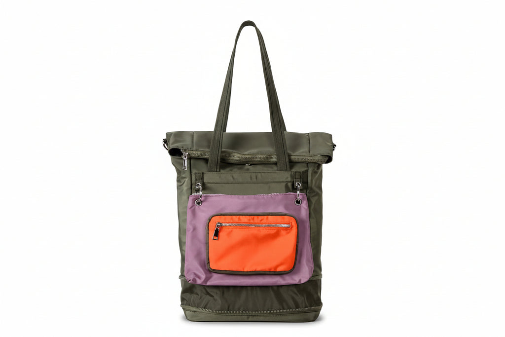 Multicolored tote bag with green, purple, and orange sections on a light gray background