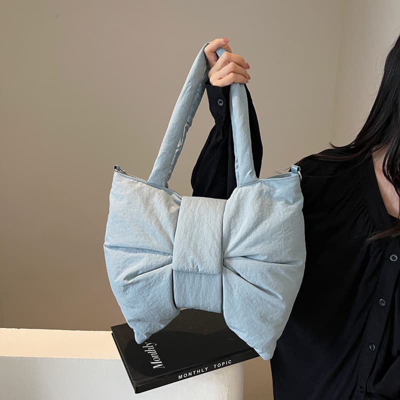 "High-fashion tote bag made for India’s trendsetters – featuring a sleek design, premium nylon finish, and waterproof build. A perfect fusion of functionality and streetwear style for Gen Z and millennial shoppers. Stand out from the crowd with Tales of Totes – India’s rising alternative to DailyObjects, Zouk, Chumbak, and Miraggio. Ideal for styling with casual, college, or office looks."

