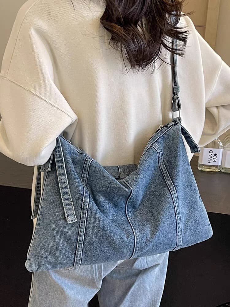 "Trendy denim sling bags in dark, mid, and light washes – designed with a soft structure, curved panel stitching, and adjustable shoulder strap. Spacious enough for daily essentials, perfect for casual outings, college, or streetwear looks. A versatile and stylish pick from Tales of Totes – elevating denim fashion bags beyond Zouk, DailyObjects, and Chumbak in India’s youth market."

