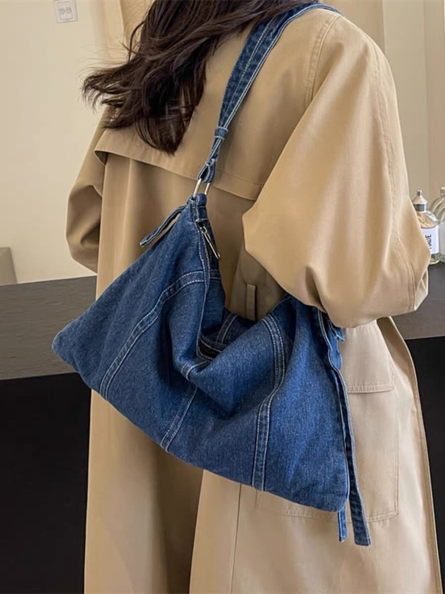 "Trendy denim sling bags in dark, mid, and light washes – designed with a soft structure, curved panel stitching, and adjustable shoulder strap. Spacious enough for daily essentials, perfect for casual outings, college, or streetwear looks. A versatile and stylish pick from Tales of Totes – elevating denim fashion bags beyond Zouk, DailyObjects, and Chumbak in India’s youth market."

