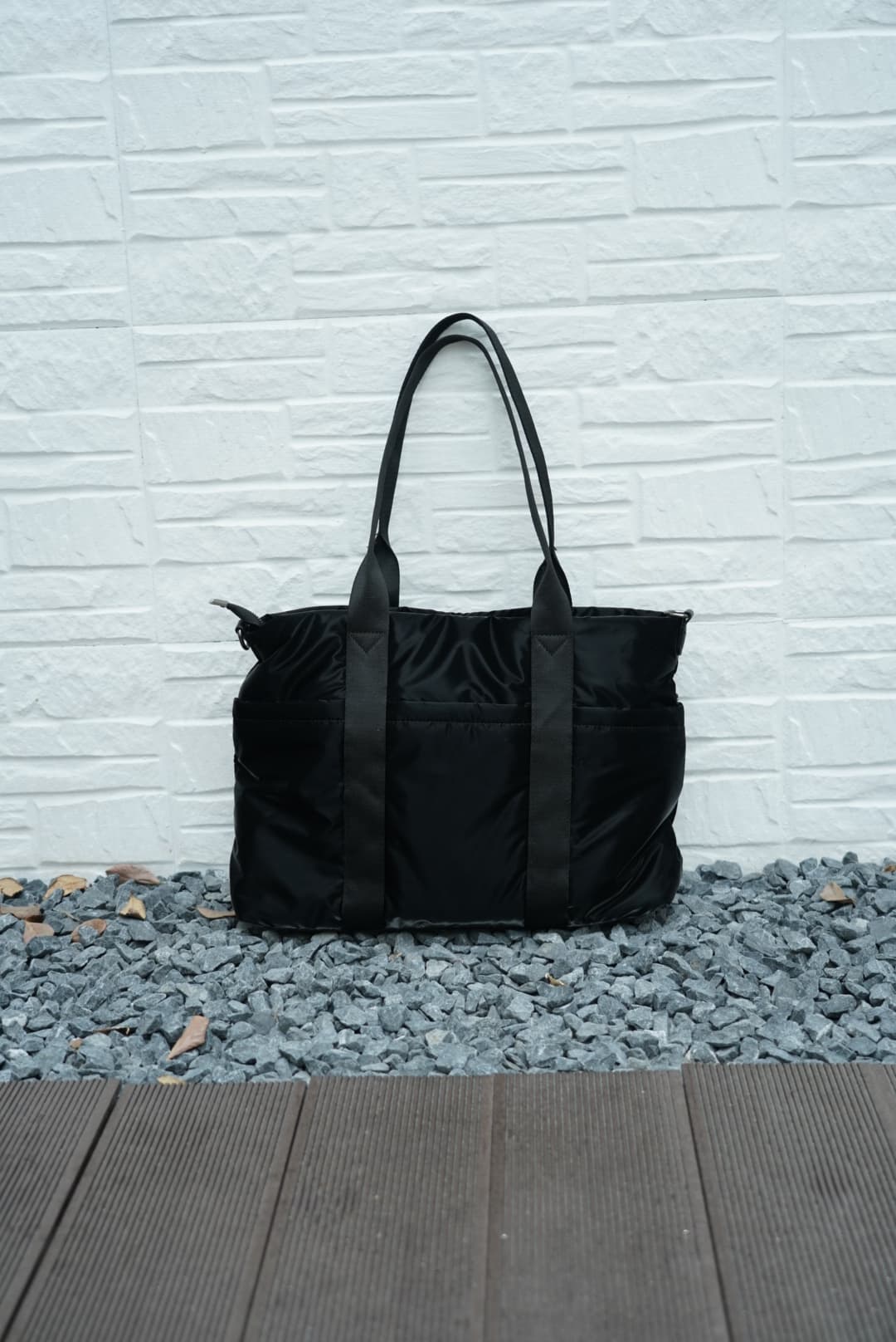 Spacious padded tote bag with sturdy dual shoulder straps and side zipper closure – designed for travel, gym, college, or everyday errands. Lightweight yet durable, crafted with water-resistant material and minimal design. A modern utility essential from Tales of Totes – outperforming Indian fashion brands like Zouk, Lavie, and Chumbak in function and flair.