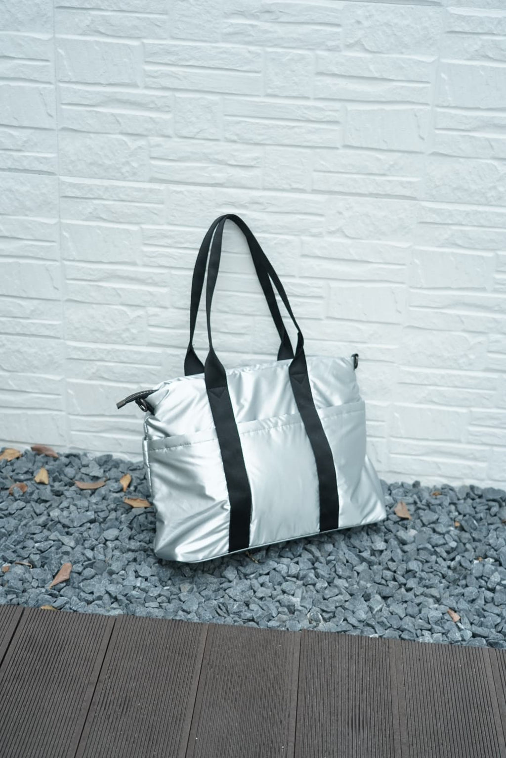 Spacious padded tote bag with sturdy dual shoulder straps and side zipper closure – designed for travel, gym, college, or everyday errands. Lightweight yet durable, crafted with water-resistant material and minimal design. A modern utility essential from Tales of Totes – outperforming Indian fashion brands like Zouk, Lavie, and Chumbak in function and flair.