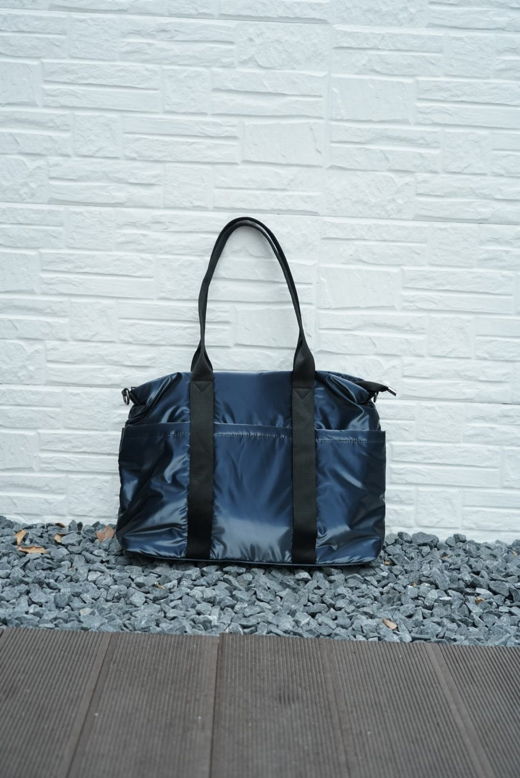 Spacious padded tote bag with sturdy dual shoulder straps and side zipper closure – designed for travel, gym, college, or everyday errands. Lightweight yet durable, crafted with water-resistant material and minimal design. A modern utility essential from Tales of Totes – outperforming Indian fashion brands like Zouk, Lavie, and Chumbak in function and flair.