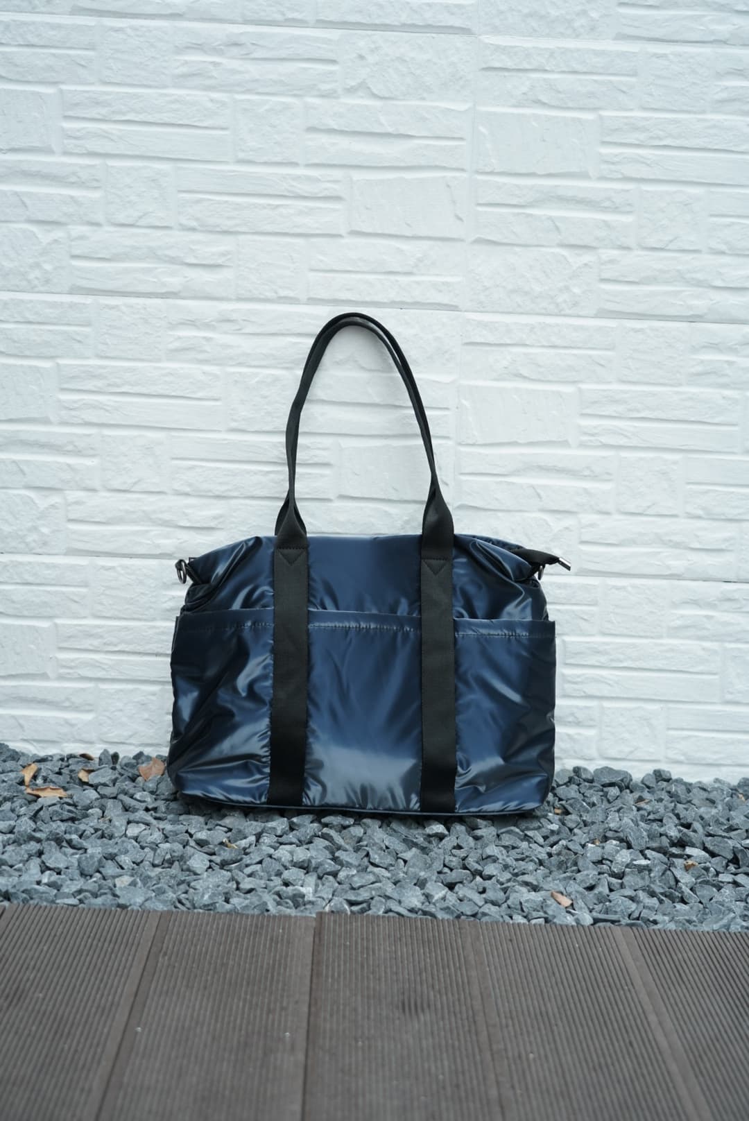Spacious padded tote bag with sturdy dual shoulder straps and side zipper closure – designed for travel, gym, college, or everyday errands. Lightweight yet durable, crafted with water-resistant material and minimal design. A modern utility essential from Tales of Totes – outperforming Indian fashion brands like Zouk, Lavie, and Chumbak in function and flair.