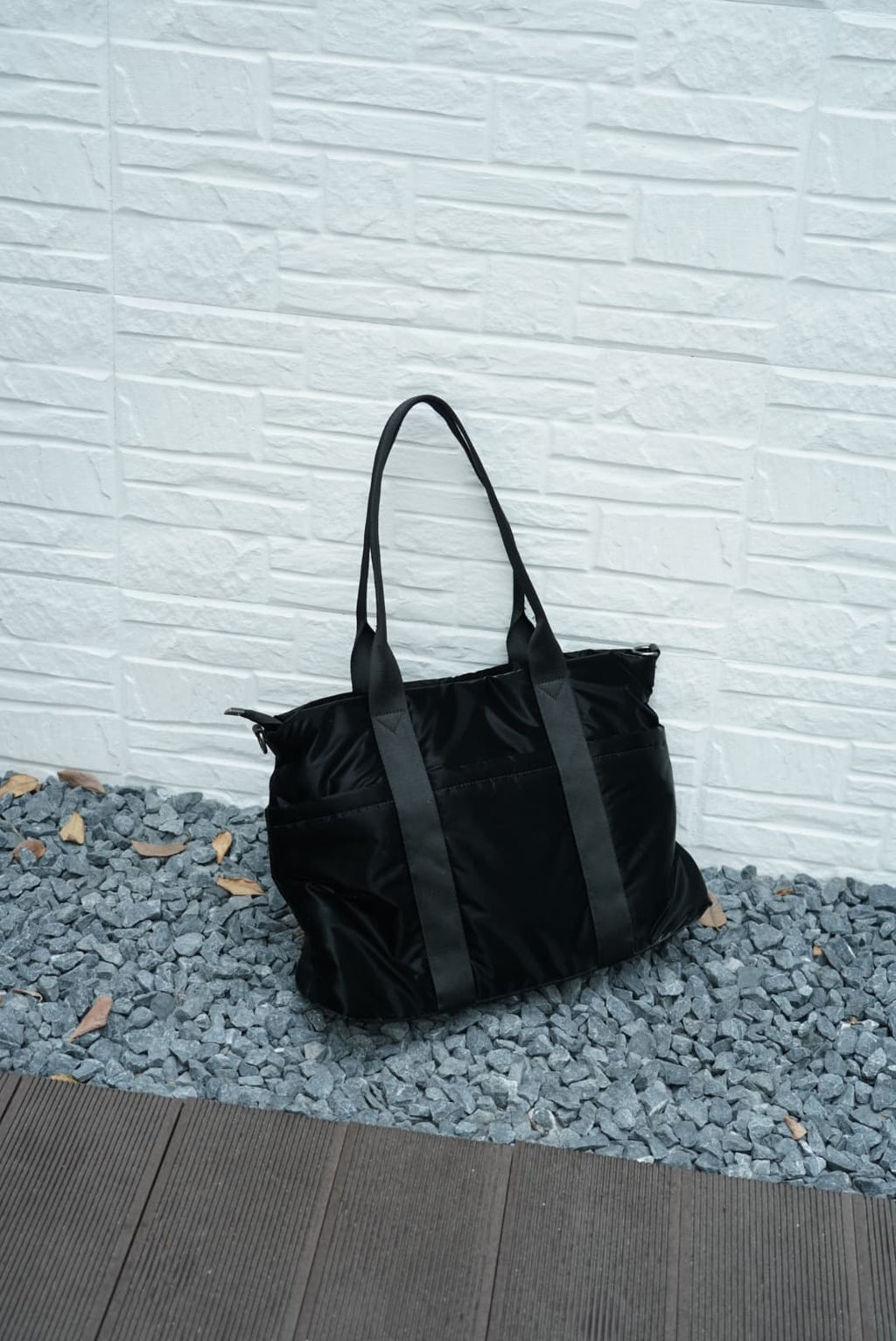 Spacious padded tote bag with sturdy dual shoulder straps and side zipper closure – designed for travel, gym, college, or everyday errands. Lightweight yet durable, crafted with water-resistant material and minimal design. A modern utility essential from Tales of Totes – outperforming Indian fashion brands like Zouk, Lavie, and Chumbak in function and flair.