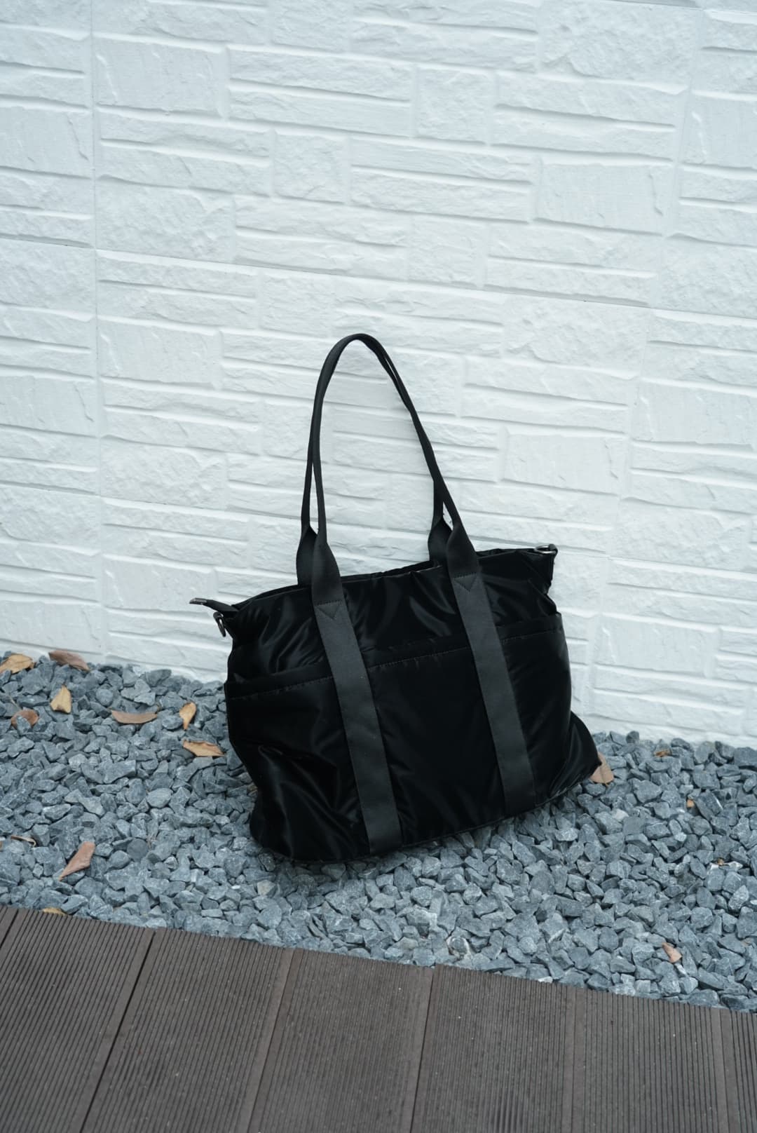 Spacious padded tote bag with sturdy dual shoulder straps and side zipper closure – designed for travel, gym, college, or everyday errands. Lightweight yet durable, crafted with water-resistant material and minimal design. A modern utility essential from Tales of Totes – outperforming Indian fashion brands like Zouk, Lavie, and Chumbak in function and flair.