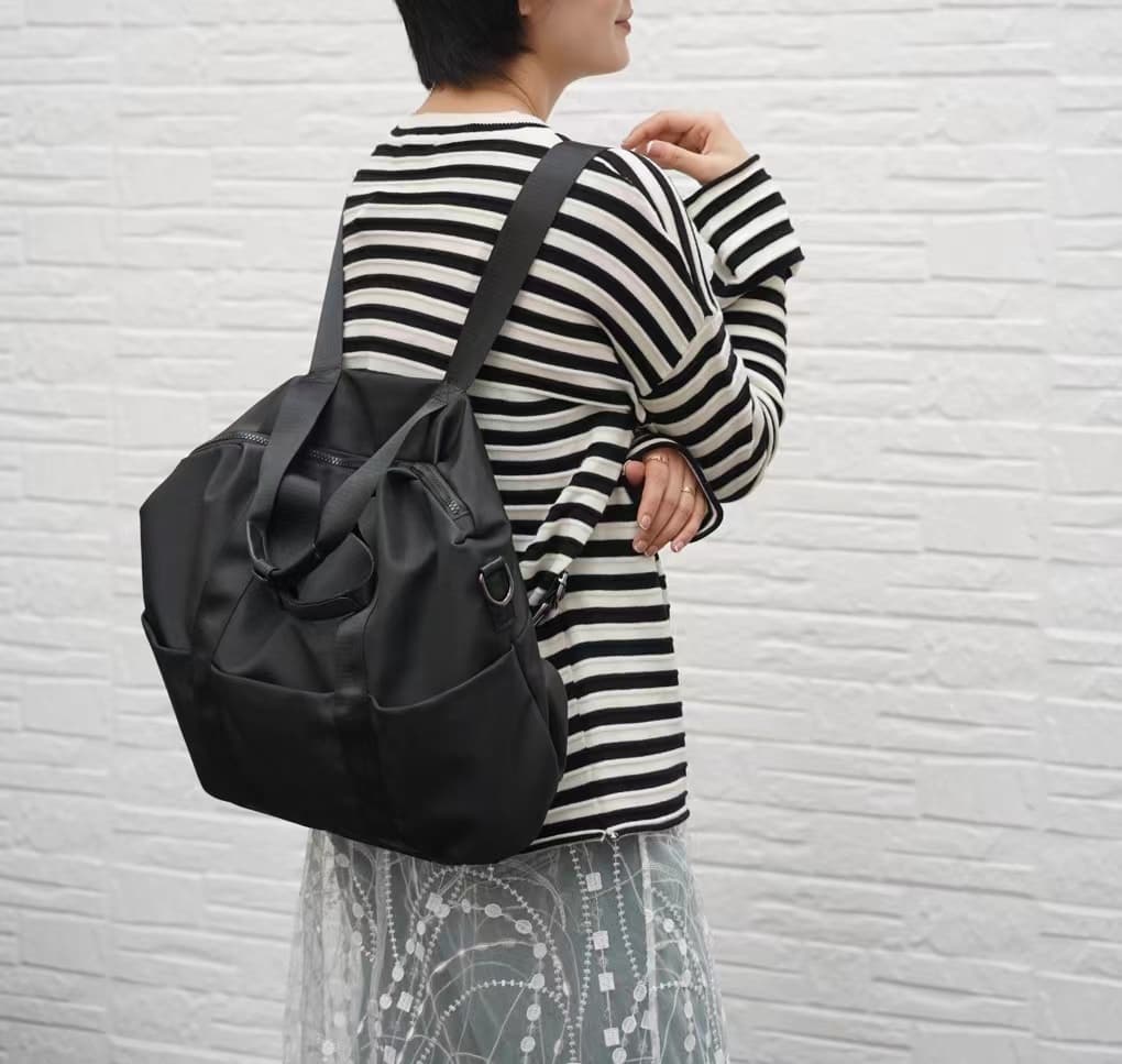 A unisex duffel tote bag with a sleek, minimal design featuring two vertical straps, dual carry handles, an adjustable shoulder strap, and side pockets. Spacious enough for travel or daily use, crafted from durable, water-resistant material with a zippered top closure. Ideal for college, gym, or casual outings.








A unisex duffel tote bag with a sleek, minimal design featuring two vertical straps, dual carry handles, an adjustable shoulder strap, and side pockets. Spacious enough for travel or daily us