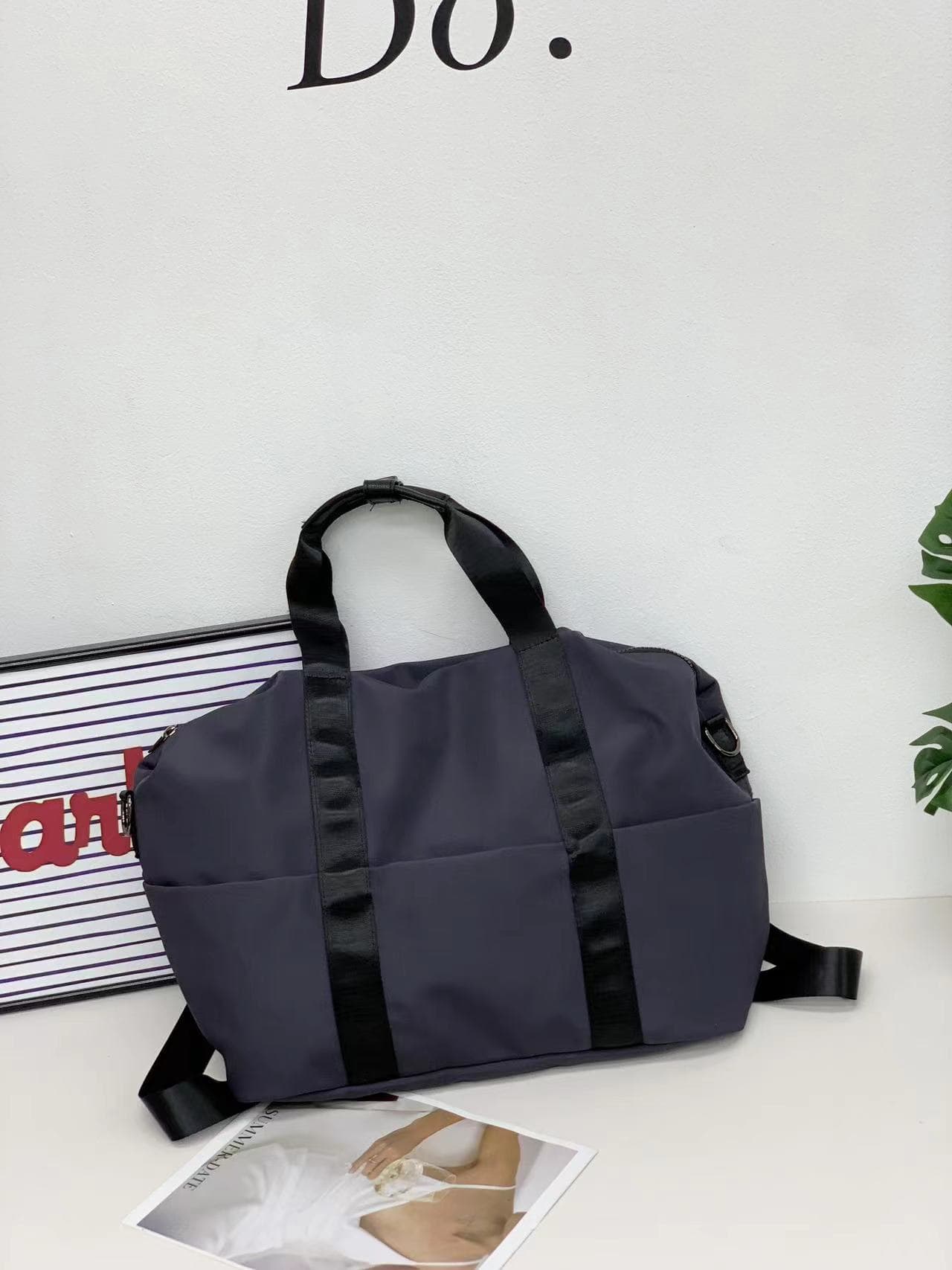A unisex duffel tote bag with a sleek, minimal design featuring two vertical straps, dual carry handles, an adjustable shoulder strap, and side pockets. Spacious enough for travel or daily use, crafted from durable, water-resistant material with a zippered top closure. Ideal for college, gym, or casual outings.








A unisex duffel tote bag with a sleek, minimal design featuring two vertical straps, dual carry handles, an adjustable shoulder strap, and side pockets. Spacious enough for travel or daily us