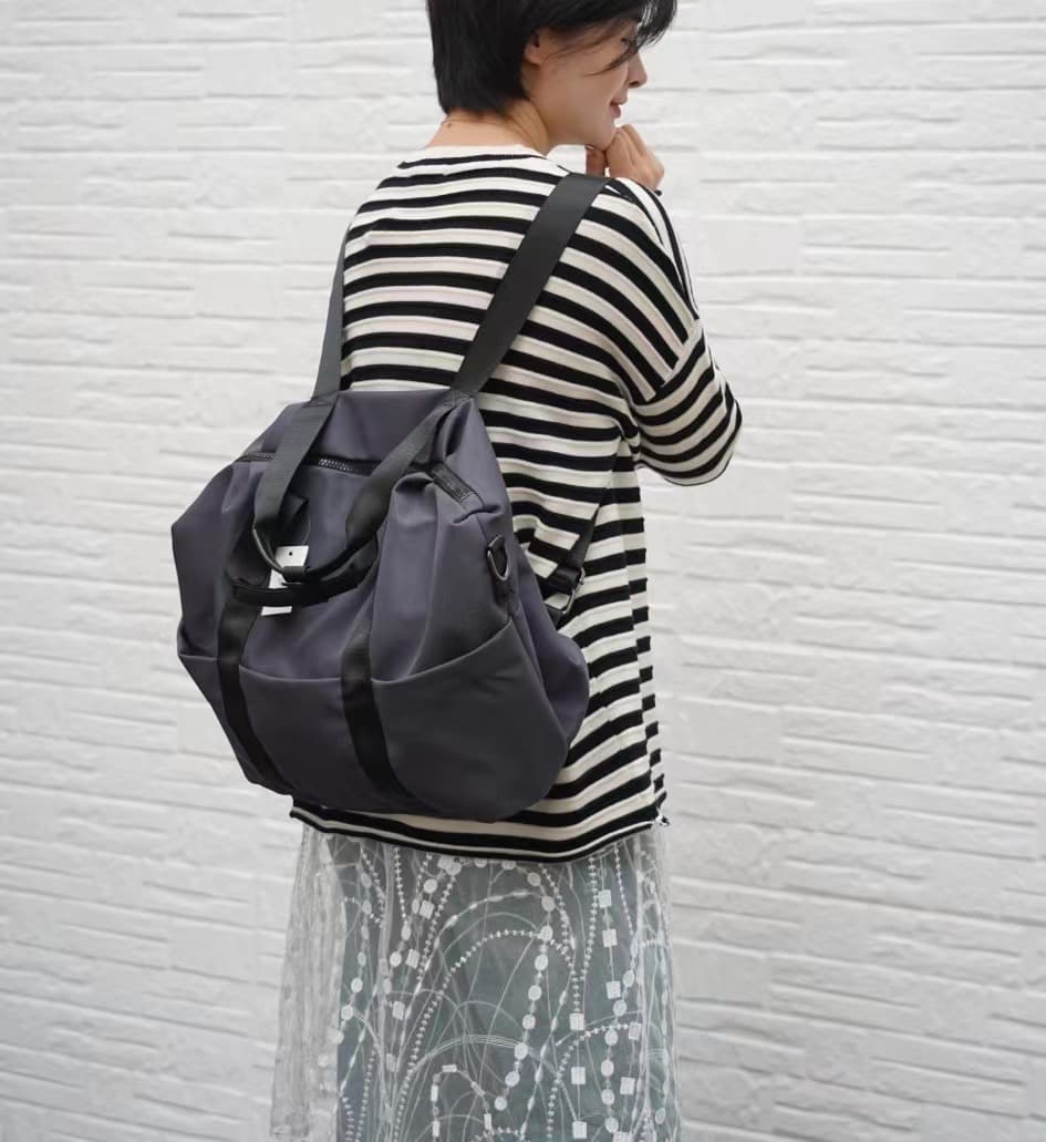 A unisex duffel tote bag with a sleek, minimal design featuring two vertical straps, dual carry handles, an adjustable shoulder strap, and side pockets. Spacious enough for travel or daily use, crafted from durable, water-resistant material with a zippered top closure. Ideal for college, gym, or casual outings.








A unisex duffel tote bag with a sleek, minimal design featuring two vertical straps, dual carry handles, an adjustable shoulder strap, and side pockets. Spacious enough for travel or daily us