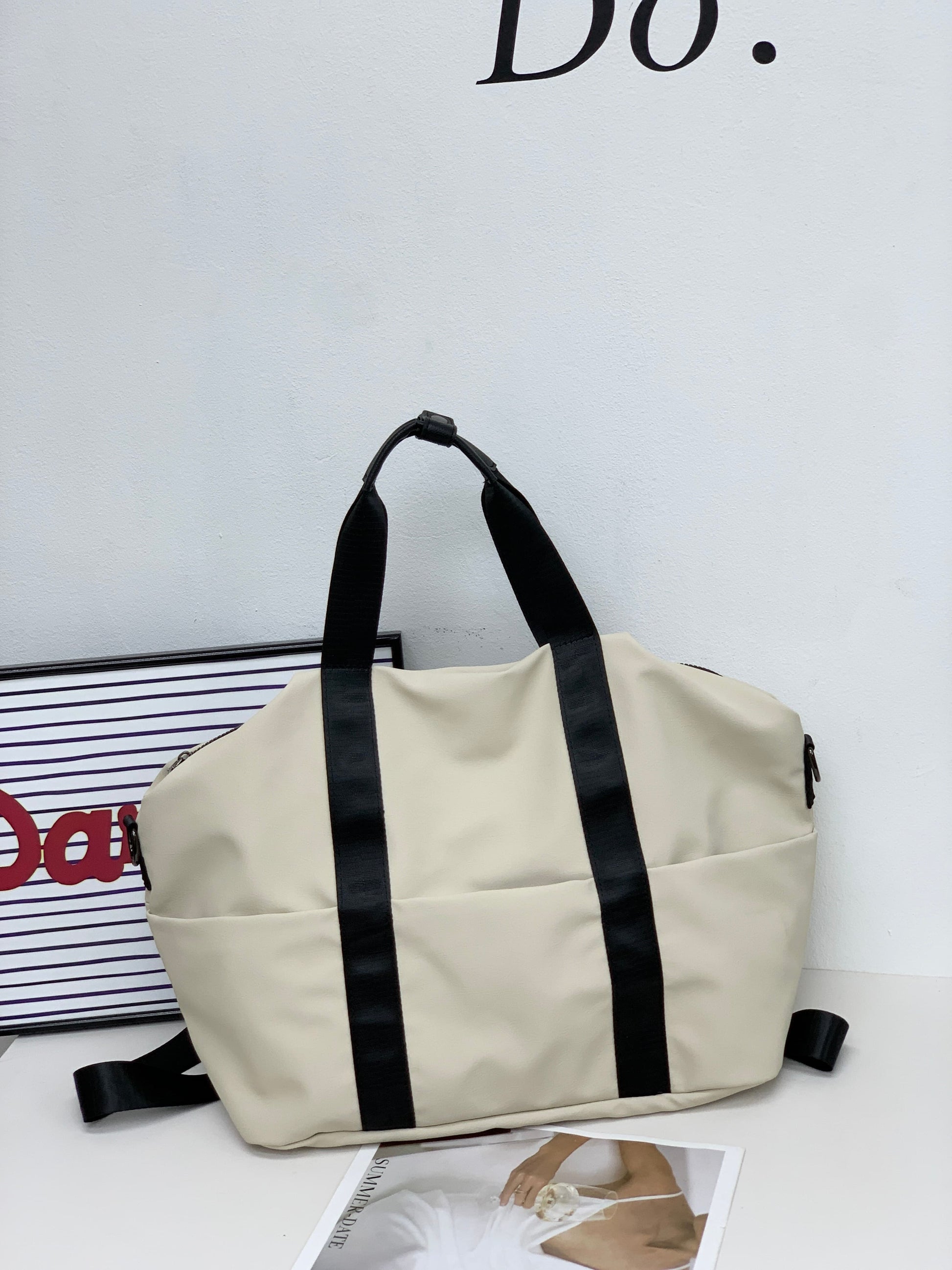 A unisex duffel tote bag with a sleek, minimal design featuring two vertical straps, dual carry handles, an adjustable shoulder strap, and side pockets. Spacious enough for travel or daily use, crafted from durable, water-resistant material with a zippered top closure. Ideal for college, gym, or casual outings.








A unisex duffel tote bag with a sleek, minimal design featuring two vertical straps, dual carry handles, an adjustable shoulder strap, and side pockets. Spacious enough for travel or daily us
