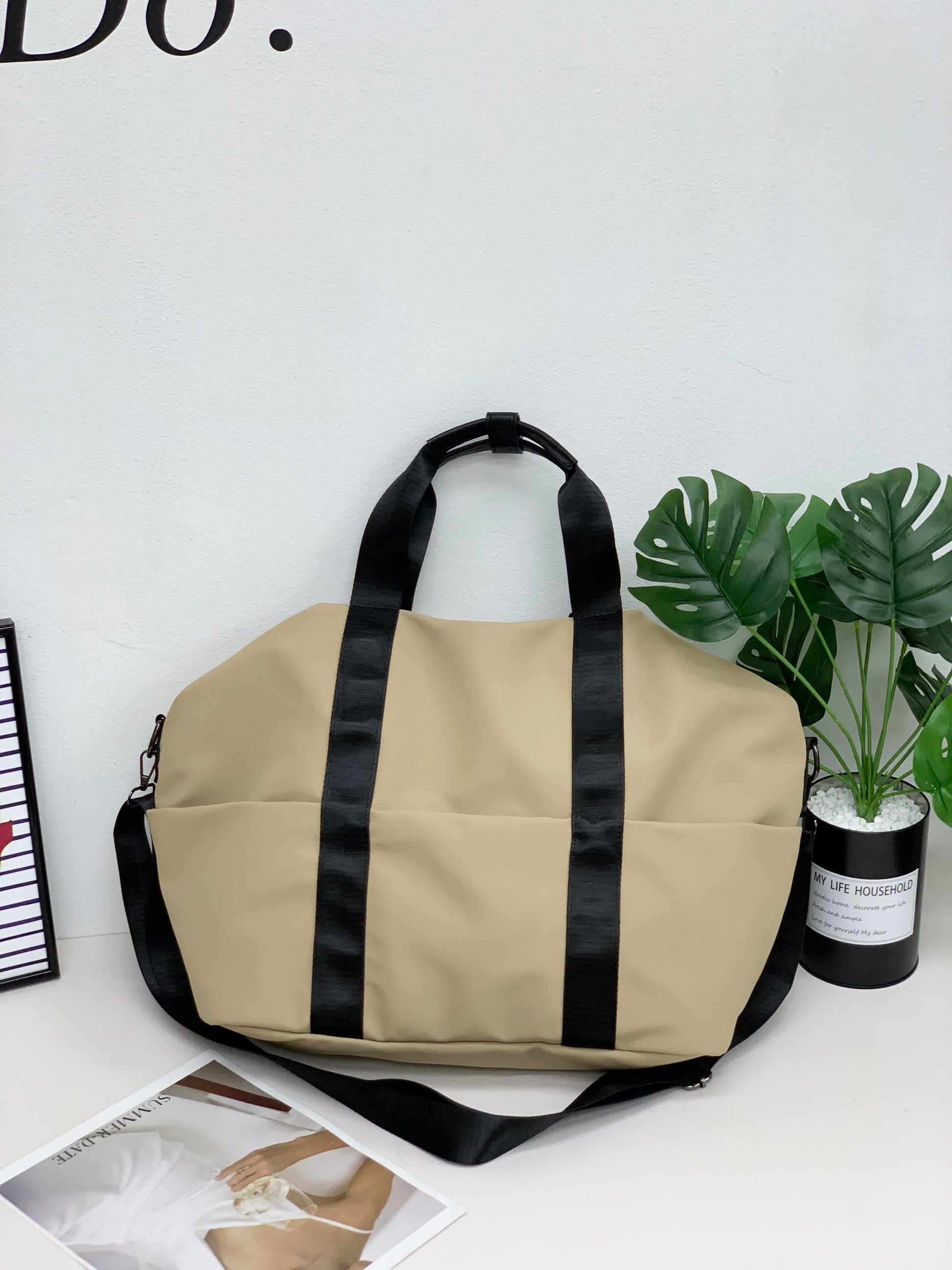A unisex duffel tote bag with a sleek, minimal design featuring two vertical straps, dual carry handles, an adjustable shoulder strap, and side pockets. Spacious enough for travel or daily use, crafted from durable, water-resistant material with a zippered top closure. Ideal for college, gym, or casual outings.








A unisex duffel tote bag with a sleek, minimal design featuring two vertical straps, dual carry handles, an adjustable shoulder strap, and side pockets. Spacious enough for travel or daily us