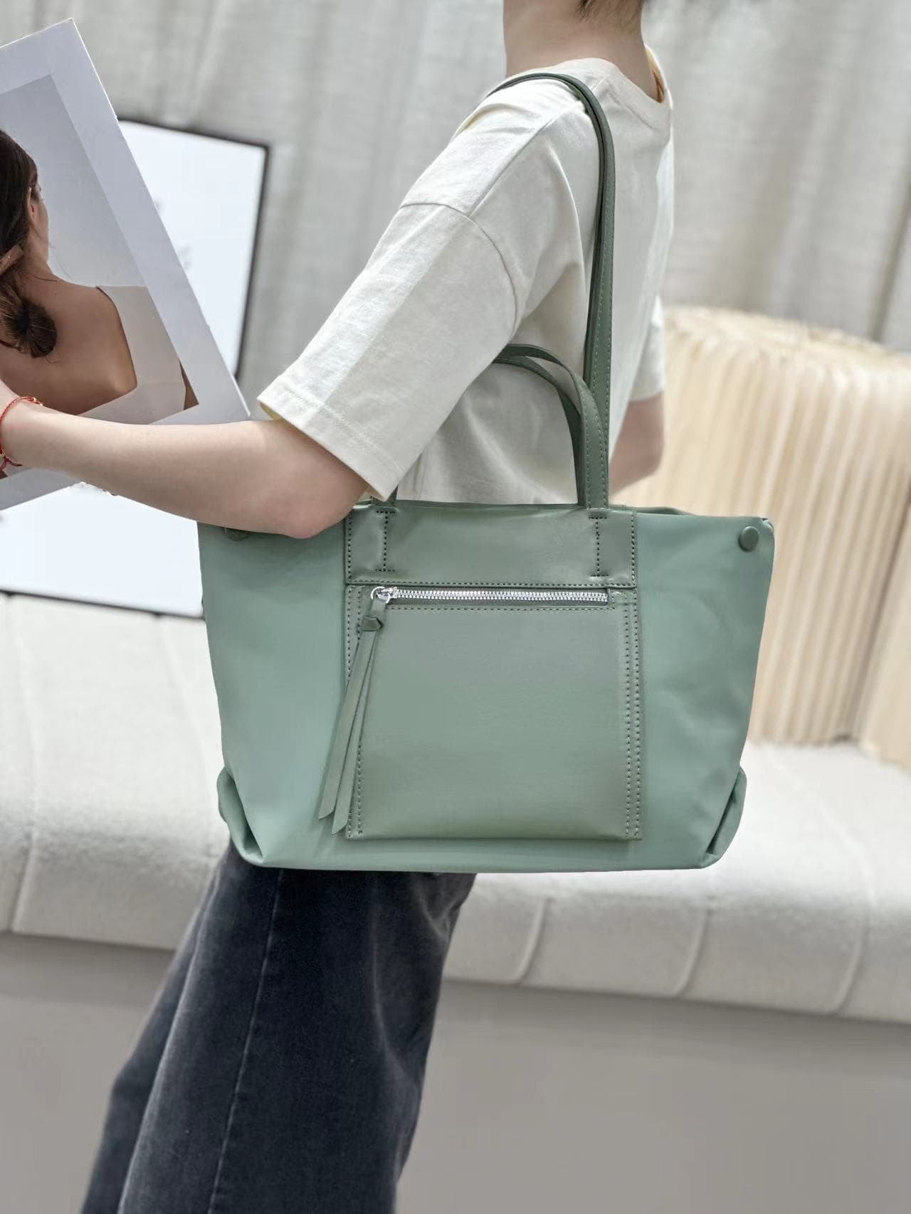 Elegant black tote bag with a sleek leather-look finish, front zip pocket, and spacious interior – perfect for office, travel, or daily use. Features dual handles, multiple compartments, and secure zip closure. A premium alternative to Zouk, DailyObjects, and Lavie bags. Shop functional yet stylish fashion accessories at Tales of Totes – India’s go-to brand for modern totes."