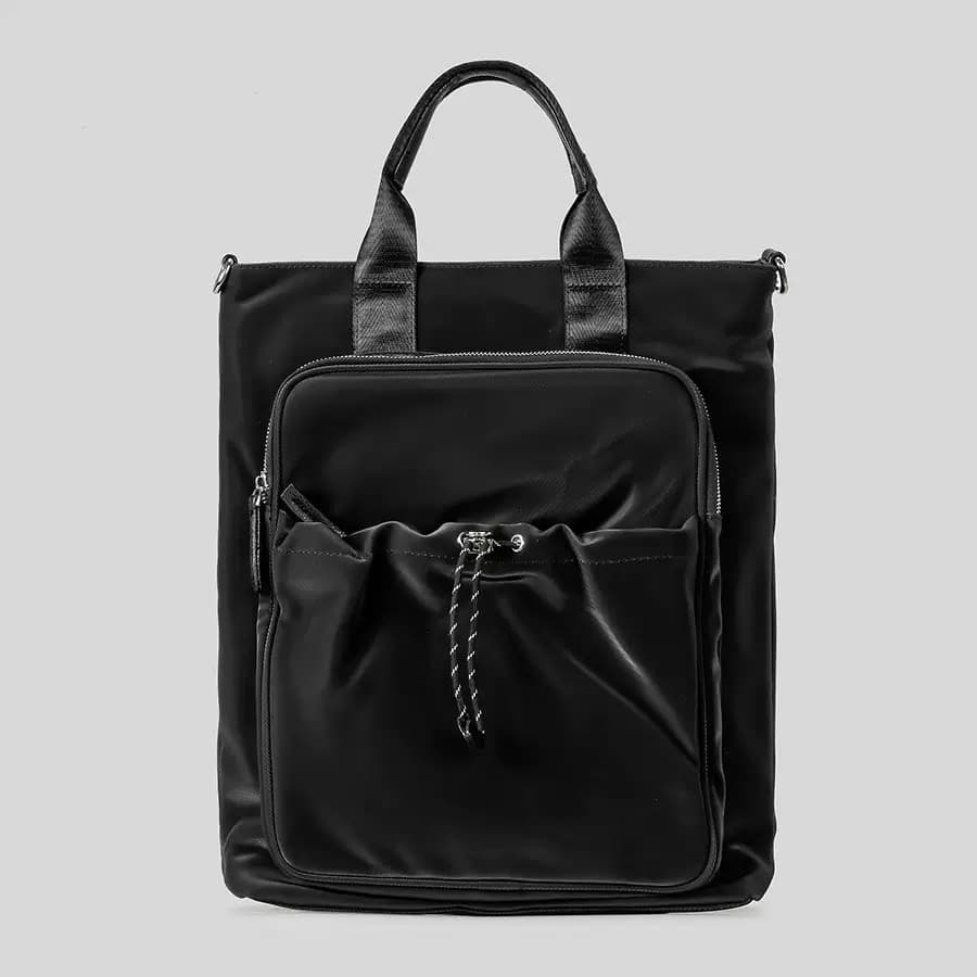 "Multi-functional travel tote bag with 20-litre capacity and compact dimensions (37.5 x 32.5 x 11.25 cm) – featuring a front utility pocket, sturdy handles, and crossbody strap for comfortable carrying. Designed for urban commuters and travellers, this spacious and durable bag combines style with practicality. A modern essential from Tales of Totes, outperforming Indian brands like Zouk, Lavie, and DailyObjects in versatility and value."

