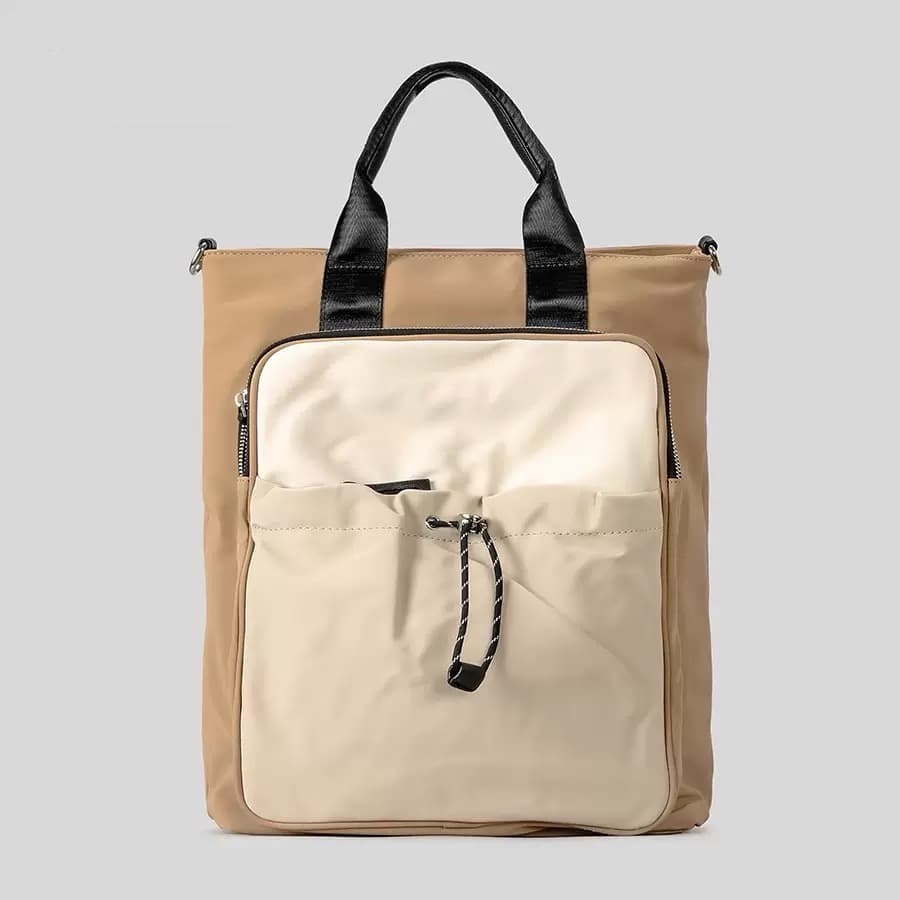 "Multi-functional travel tote bag with 20-litre capacity and compact dimensions (37.5 x 32.5 x 11.25 cm) – featuring a front utility pocket, sturdy handles, and crossbody strap for comfortable carrying. Designed for urban commuters and travellers, this spacious and durable bag combines style with practicality. A modern essential from Tales of Totes, outperforming Indian brands like Zouk, Lavie, and DailyObjects in versatility and value."

