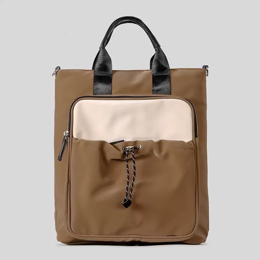 "Multi-functional travel tote bag with 20-litre capacity and compact dimensions (37.5 x 32.5 x 11.25 cm) – featuring a front utility pocket, sturdy handles, and crossbody strap for comfortable carrying. Designed for urban commuters and travellers, this spacious and durable bag combines style with practicality. A modern essential from Tales of Totes, outperforming Indian brands like Zouk, Lavie, and DailyObjects in versatility and value."

