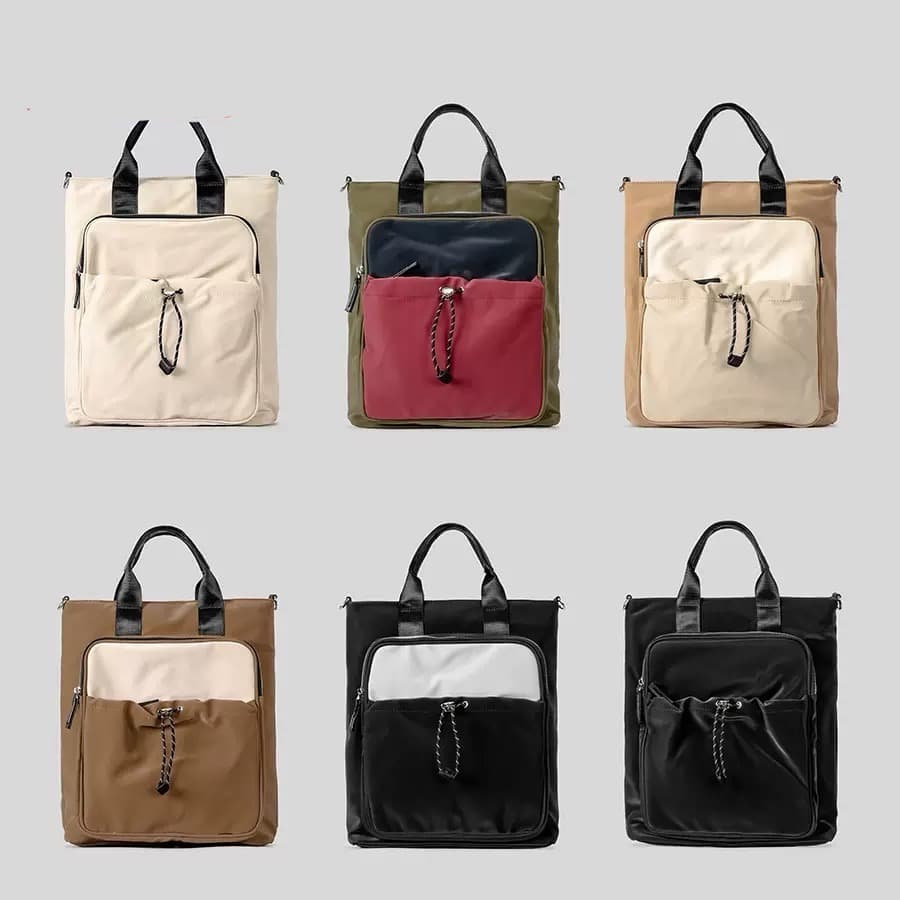 "Multi-functional travel tote bag with 20-litre capacity and compact dimensions (37.5 x 32.5 x 11.25 cm) – featuring a front utility pocket, sturdy handles, and crossbody strap for comfortable carrying. Designed for urban commuters and travellers, this spacious and durable bag combines style with practicality. A modern essential from Tales of Totes, outperforming Indian brands like Zouk, Lavie, and DailyObjects in versatility and value."

