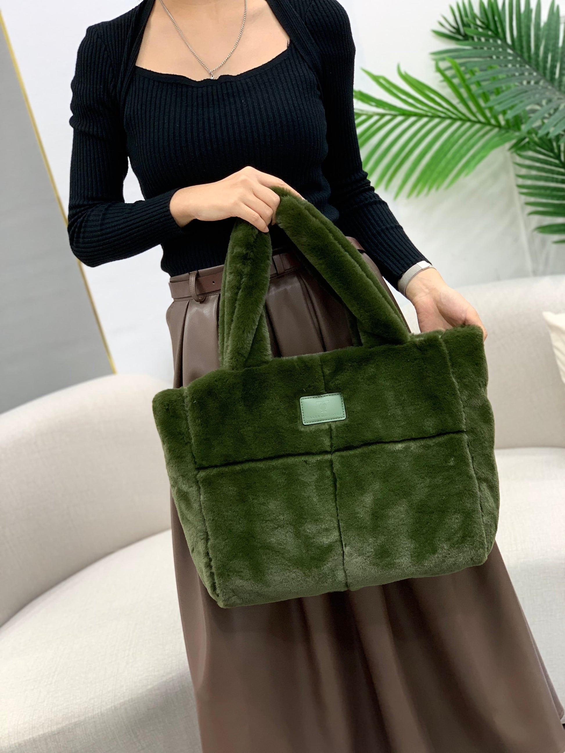 Plush faux fur tote bag with padded handles, zippered top, and spacious interior – designed for cozy winter outings and everyday comfort. Soft, lightweight, and stylish, perfect for carrying essentials in cold weather. A chic and functional piece from Tales of Totes – standing out from Indian brands like Zouk, Chumbak, and Miraggio with unique textures and winter-ready fashion flair."

