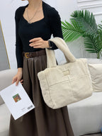 Plush faux fur tote bag with padded handles, zippered top, and spacious interior – designed for cozy winter outings and everyday comfort. Soft, lightweight, and stylish, perfect for carrying essentials in cold weather. A chic and functional piece from Tales of Totes – standing out from Indian brands like Zouk, Chumbak, and Miraggio with unique textures and winter-ready fashion flair."

