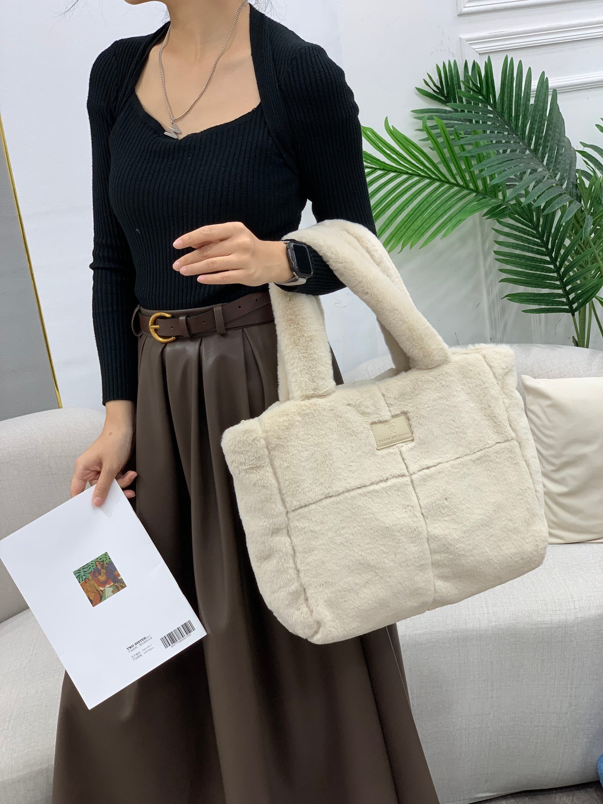 Plush faux fur tote bag with padded handles, zippered top, and spacious interior – designed for cozy winter outings and everyday comfort. Soft, lightweight, and stylish, perfect for carrying essentials in cold weather. A chic and functional piece from Tales of Totes – standing out from Indian brands like Zouk, Chumbak, and Miraggio with unique textures and winter-ready fashion flair."

