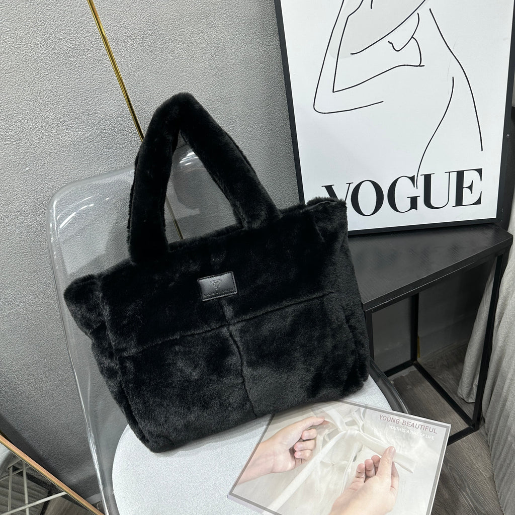 Plush faux fur tote bag with padded handles, zippered top, and spacious interior – designed for cozy winter outings and everyday comfort. Soft, lightweight, and stylish, perfect for carrying essentials in cold weather. A chic and functional piece from Tales of Totes – standing out from Indian brands like Zouk, Chumbak, and Miraggio with unique textures and winter-ready fashion flair."

