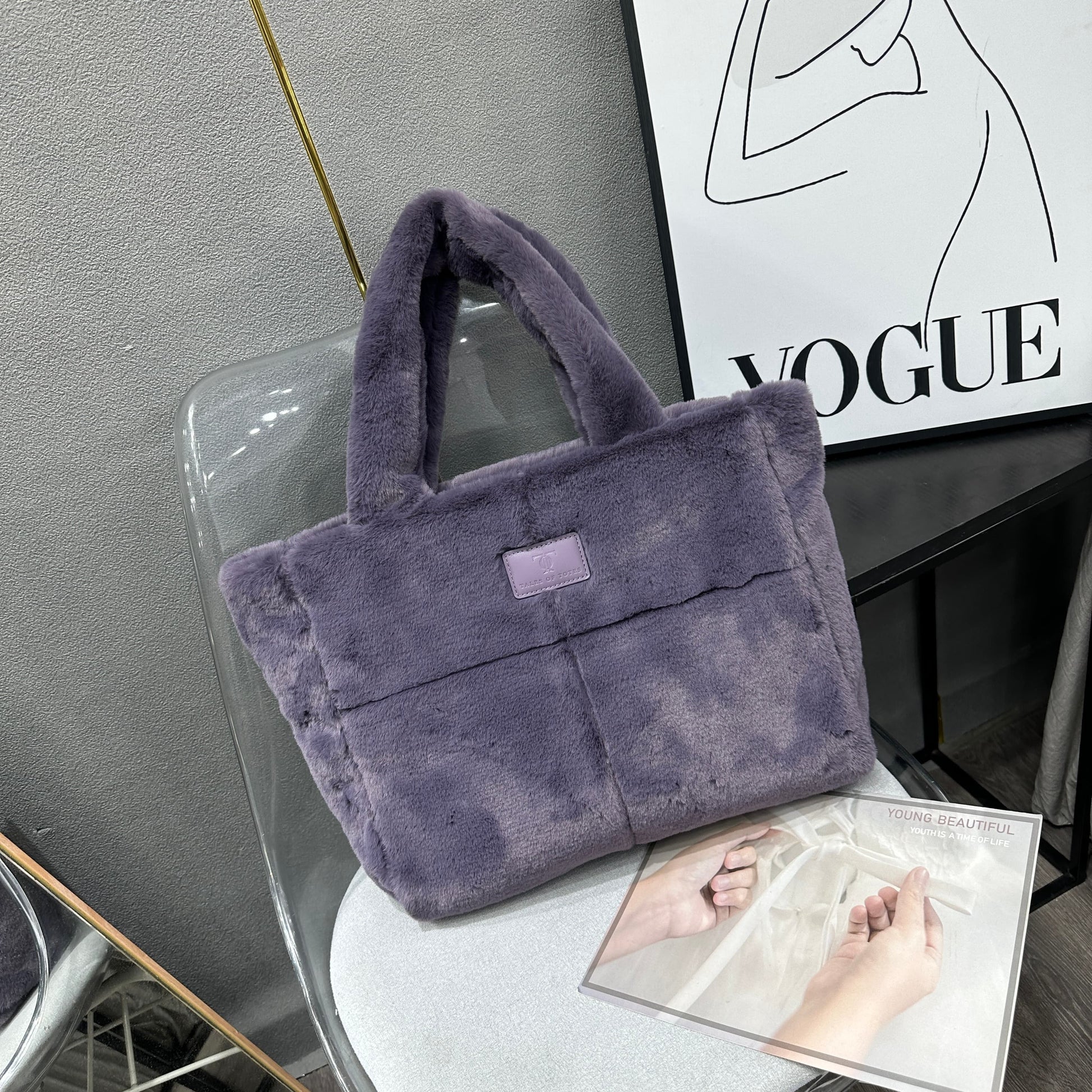 Plush faux fur tote bag with padded handles, zippered top, and spacious interior – designed for cozy winter outings and everyday comfort. Soft, lightweight, and stylish, perfect for carrying essentials in cold weather. A chic and functional piece from Tales of Totes – standing out from Indian brands like Zouk, Chumbak, and Miraggio with unique textures and winter-ready fashion flair."

