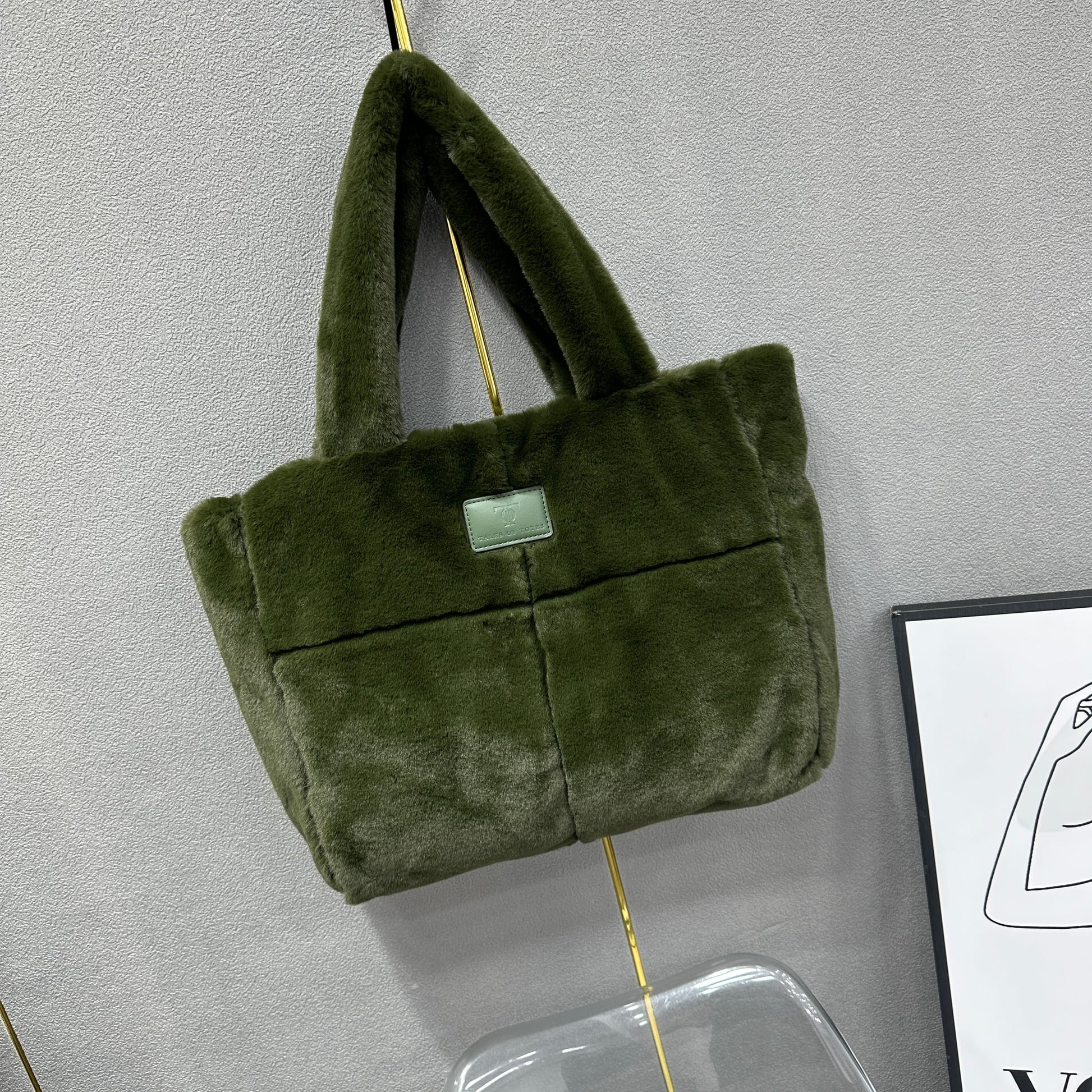 Plush faux fur tote bag with padded handles, zippered top, and spacious interior – designed for cozy winter outings and everyday comfort. Soft, lightweight, and stylish, perfect for carrying essentials in cold weather. A chic and functional piece from Tales of Totes – standing out from Indian brands like Zouk, Chumbak, and Miraggio with unique textures and winter-ready fashion flair."

