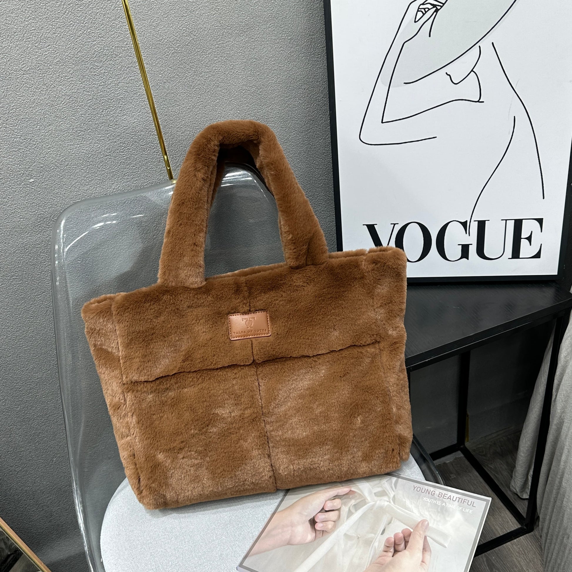 Plush faux fur tote bag with padded handles, zippered top, and spacious interior – designed for cozy winter outings and everyday comfort. Soft, lightweight, and stylish, perfect for carrying essentials in cold weather. A chic and functional piece from Tales of Totes – standing out from Indian brands like Zouk, Chumbak, and Miraggio with unique textures and winter-ready fashion flair."

