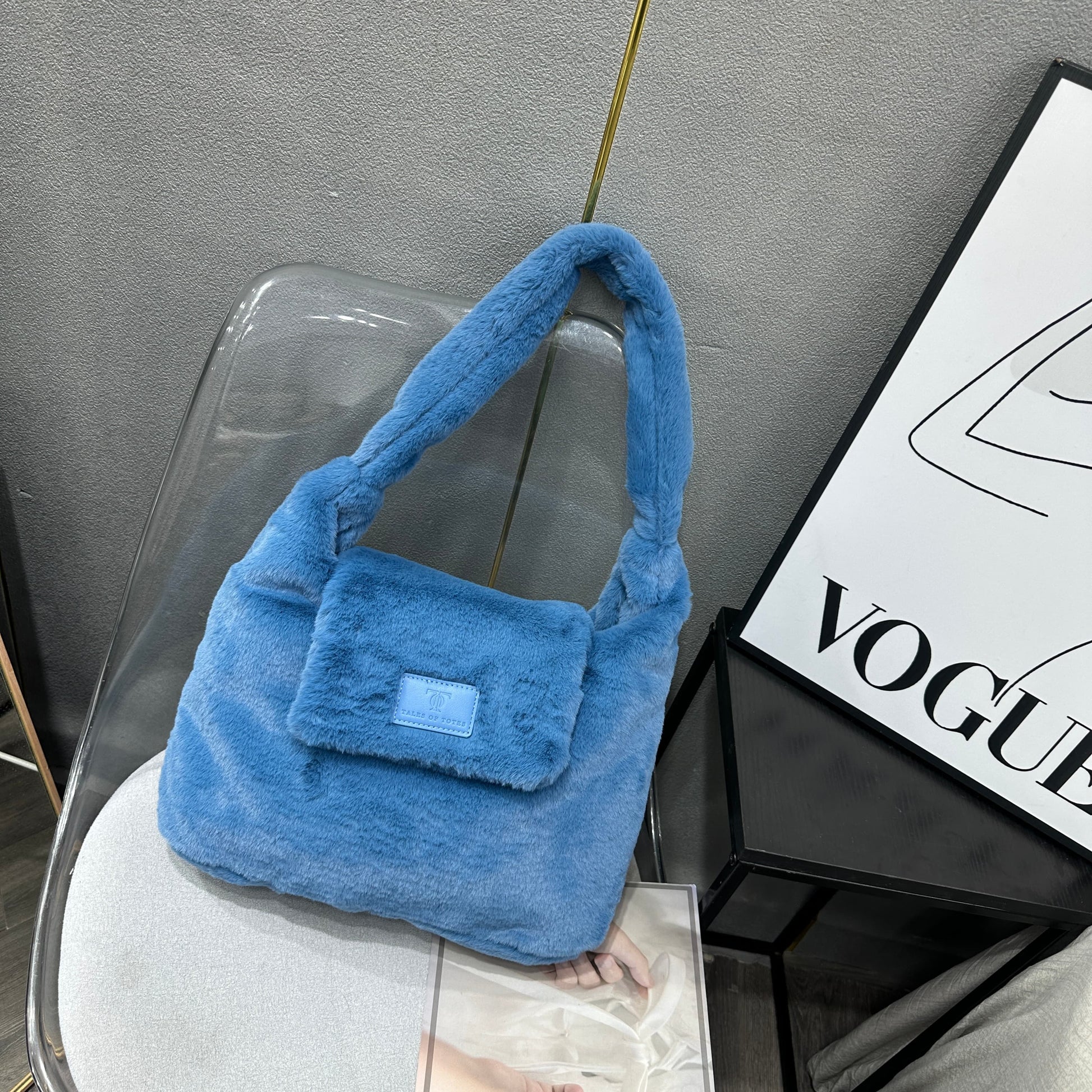 Soft faux fur tote bag with padded handles, front flap pocket, and zippered main compartment – designed for cozy winter style and functional everyday use. Spacious enough for essentials like cosmetics, wallet, and phone. A trendy winter accessory from Tales of Totes, offering stylish comfort beyond Indian brands like Zouk, Chumbak, and Miraggio."

