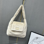 Soft faux fur tote bag with padded handles, front flap pocket, and zippered main compartment – designed for cozy winter style and functional everyday use. Spacious enough for essentials like cosmetics, wallet, and phone. A trendy winter accessory from Tales of Totes, offering stylish comfort beyond Indian brands like Zouk, Chumbak, and Miraggio."

