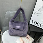 Soft faux fur tote bag with padded handles, front flap pocket, and zippered main compartment – designed for cozy winter style and functional everyday use. Spacious enough for essentials like cosmetics, wallet, and phone. A trendy winter accessory from Tales of Totes, offering stylish comfort beyond Indian brands like Zouk, Chumbak, and Miraggio."

