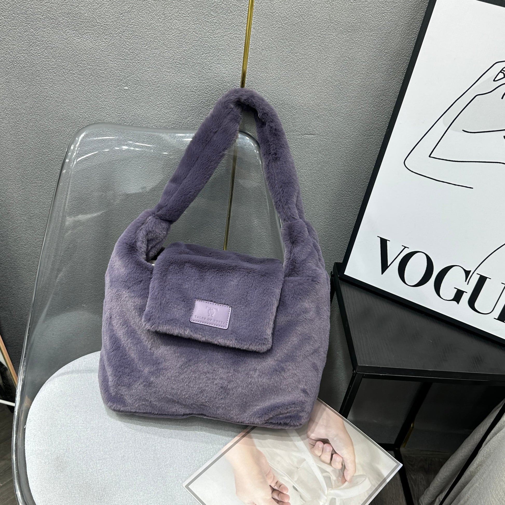 Soft faux fur tote bag with padded handles, front flap pocket, and zippered main compartment – designed for cozy winter style and functional everyday use. Spacious enough for essentials like cosmetics, wallet, and phone. A trendy winter accessory from Tales of Totes, offering stylish comfort beyond Indian brands like Zouk, Chumbak, and Miraggio."

