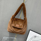 Soft faux fur tote bag with padded handles, front flap pocket, and zippered main compartment – designed for cozy winter style and functional everyday use. Spacious enough for essentials like cosmetics, wallet, and phone. A trendy winter accessory from Tales of Totes, offering stylish comfort beyond Indian brands like Zouk, Chumbak, and Miraggio."

